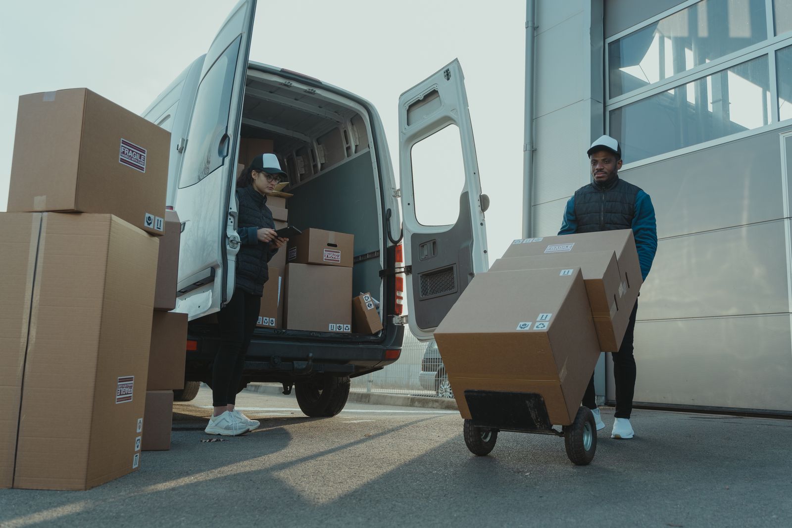 Globion couriers unloading parcels from a delivery van