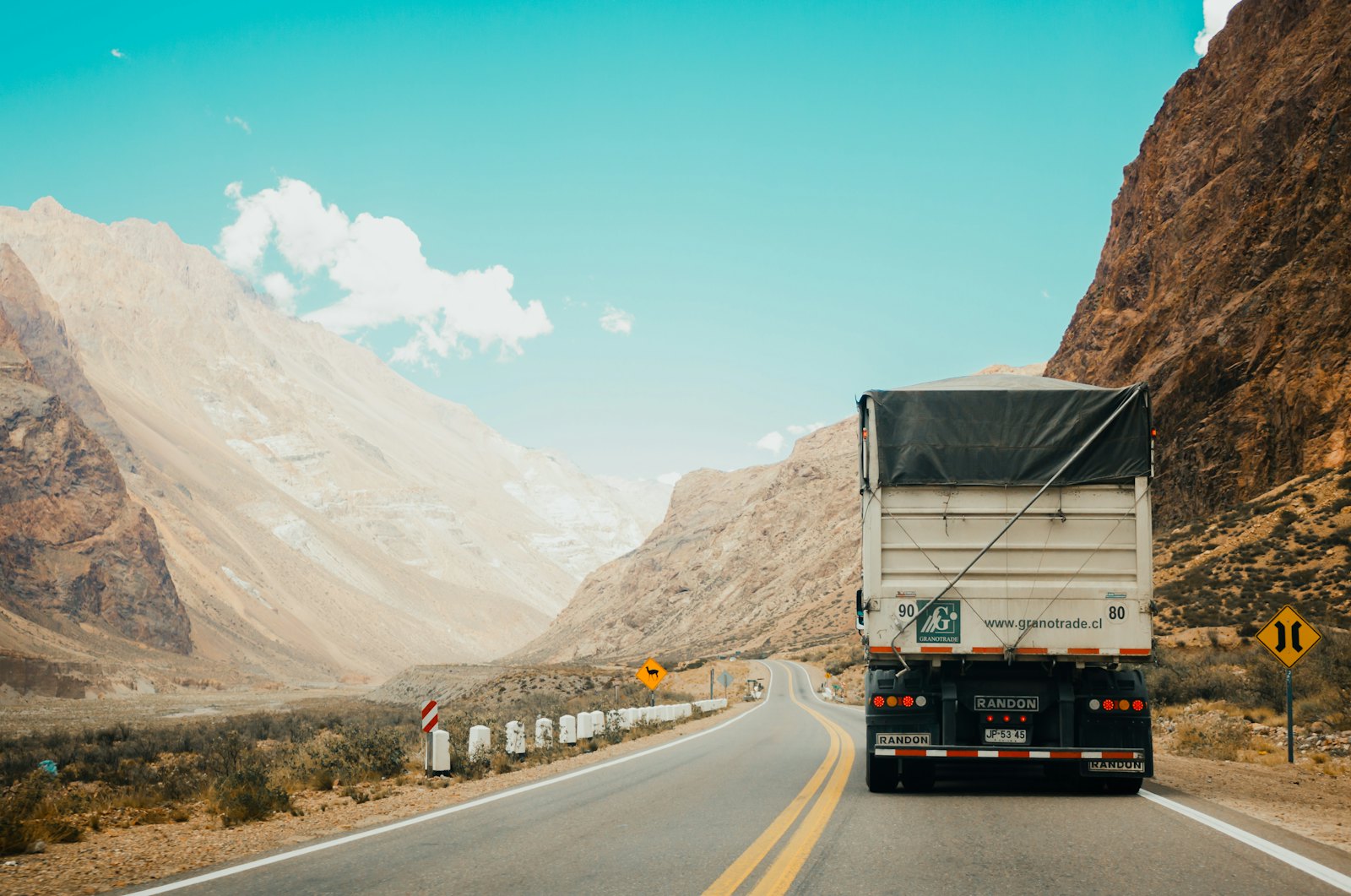 Freight truck hauling cargo on a mountain highway
