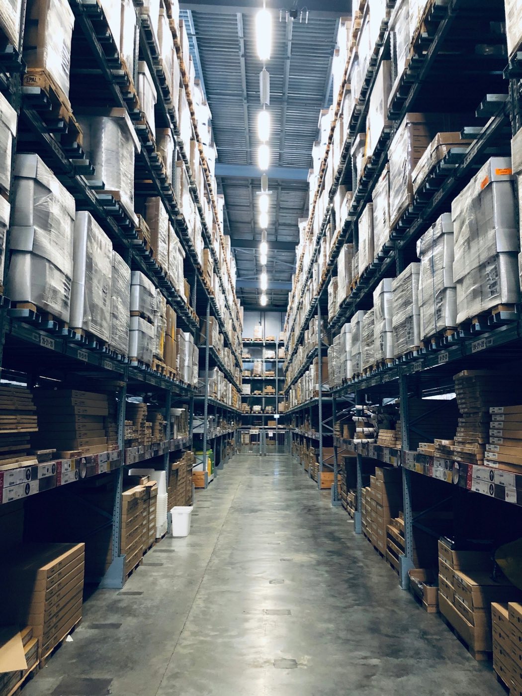 High-bay warehouse aisle inside a Globion facility